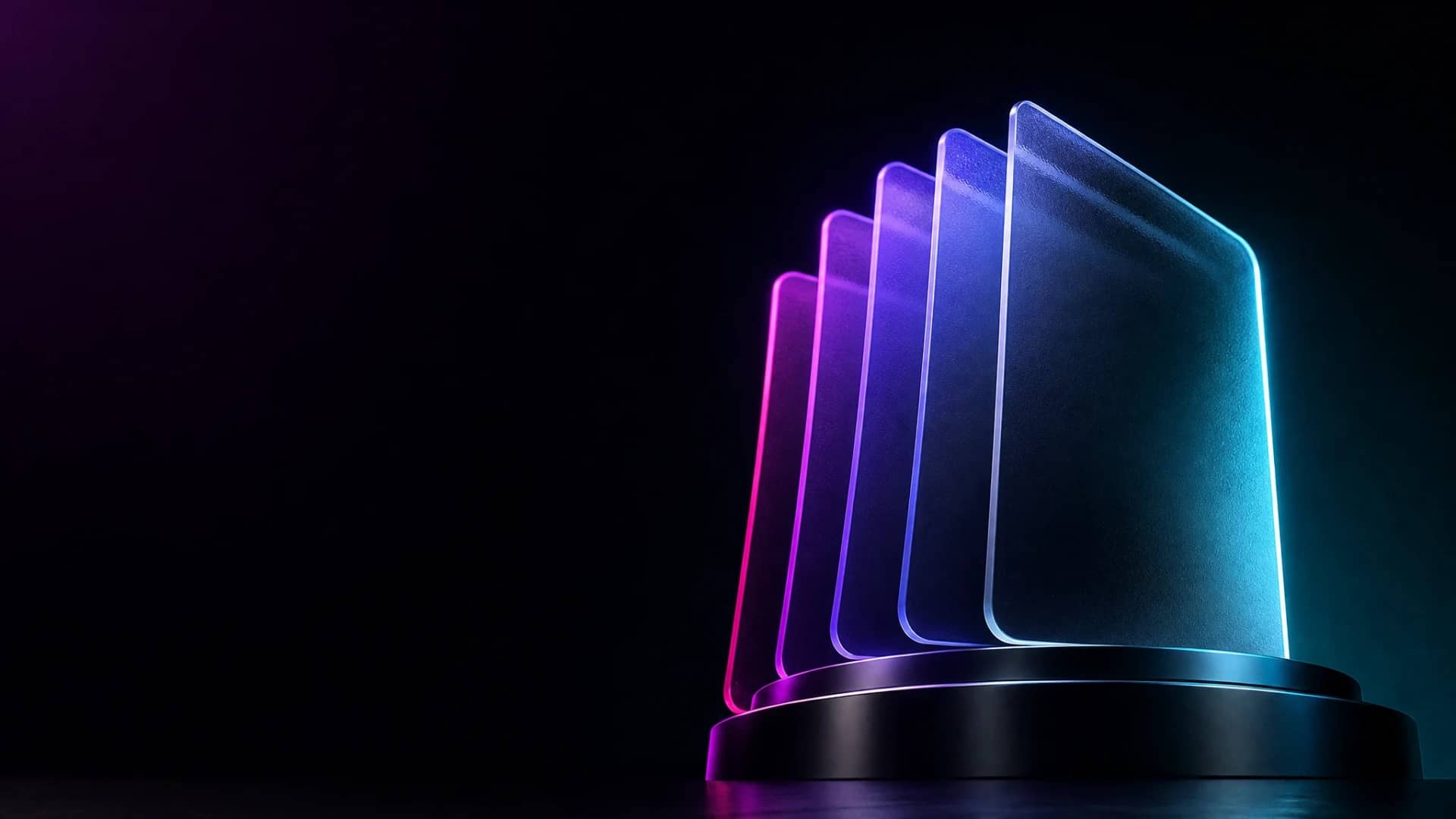 A neat stack of blank frosted glass cards fanned slightly, lit in magenta and cyan light