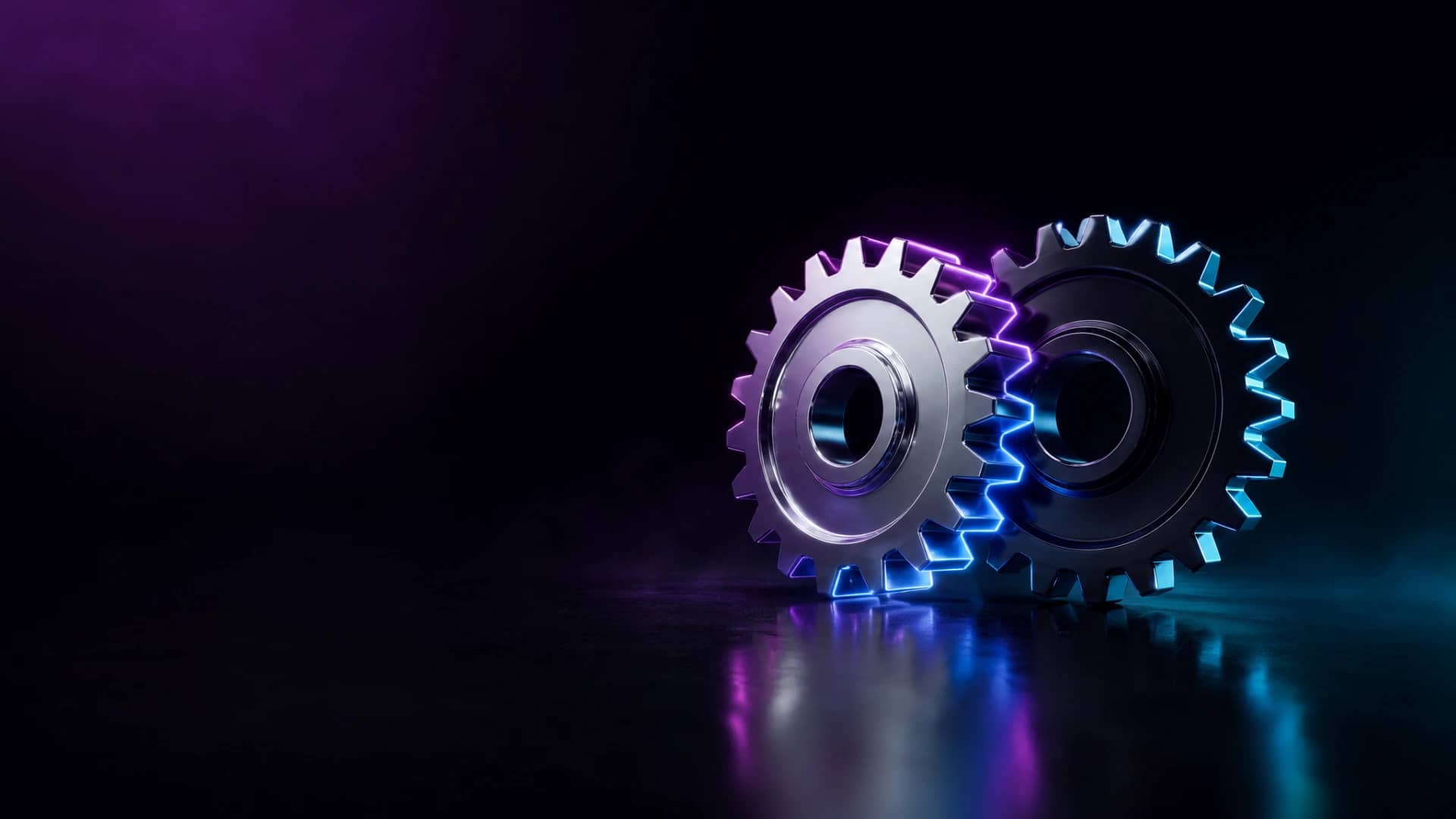 Two interlocking chrome and obsidian gears meshing together, lit with magenta and cyan neon light.