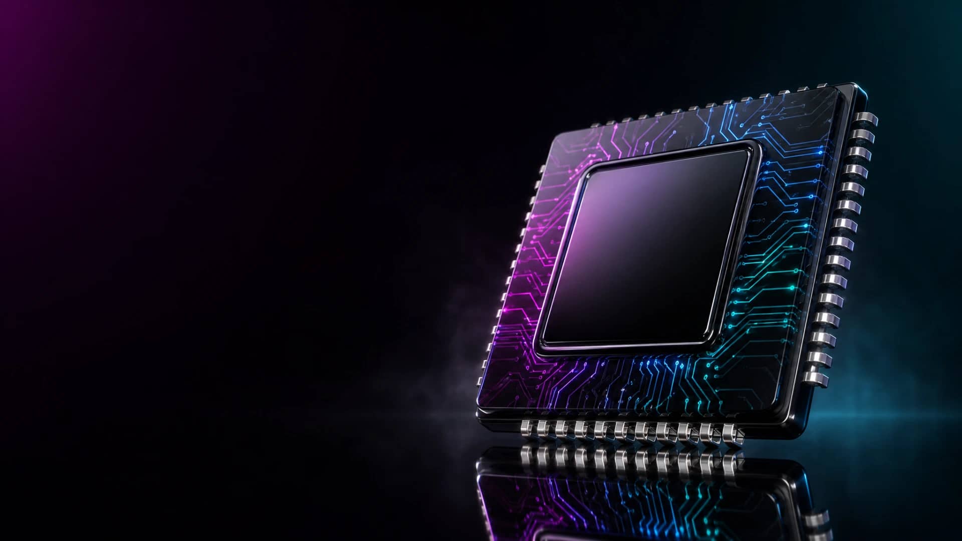 A large black obsidian microchip with chrome contacts and glowing magenta-to-cyan circuit traces lit by neon.